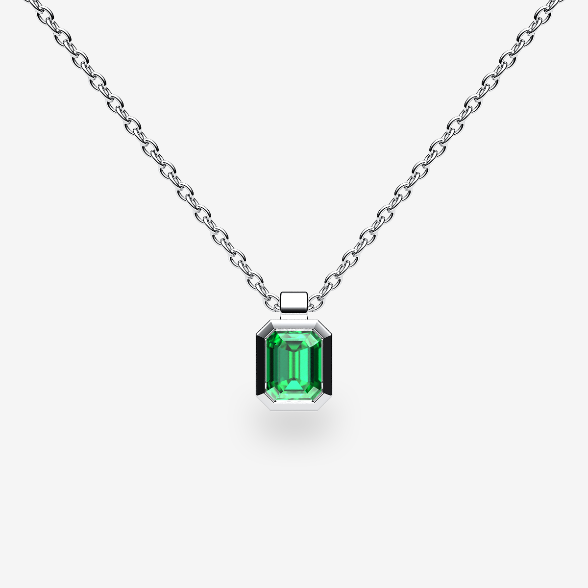 Platinum 950‰ Emerald bezel set pendant
